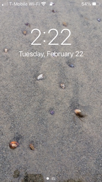 Phone screen that reads: "2:22 Tuesday, February 22."